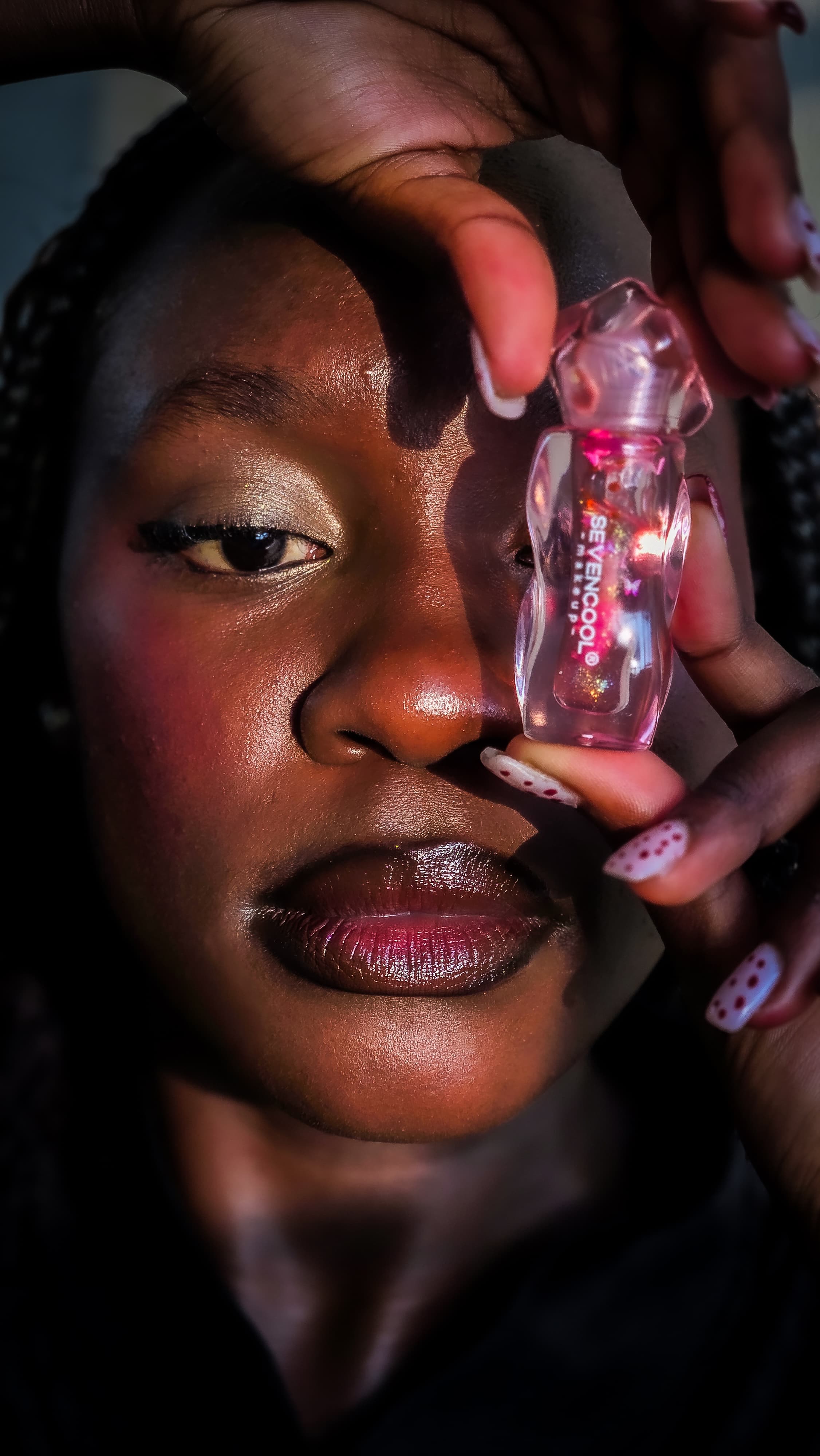 Editorial portrait of a woman with high-gloss lips in soft morning light